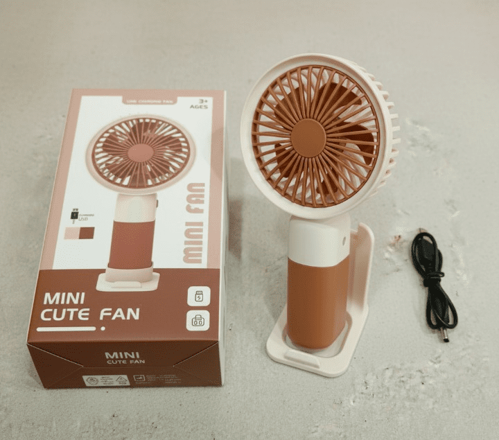 Gemini_Generated_Image_rfzflwrfzflwrfzf_cleanup.png Mini Cute Fan – Portable USB Rechargeable Handheld Cooling Fan for Kids & Adults, Stand/Base Included (Random Color) - Image 7