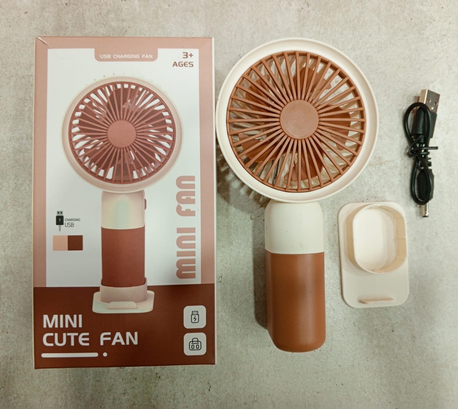 WhatsApp-Image-2025-08-27-at-4.56.44-PM.jpeg Mini Cute Fan – Portable USB Rechargeable Handheld Cooling Fan for Kids & Adults, Stand/Base Included (Random Color) - Image 3
