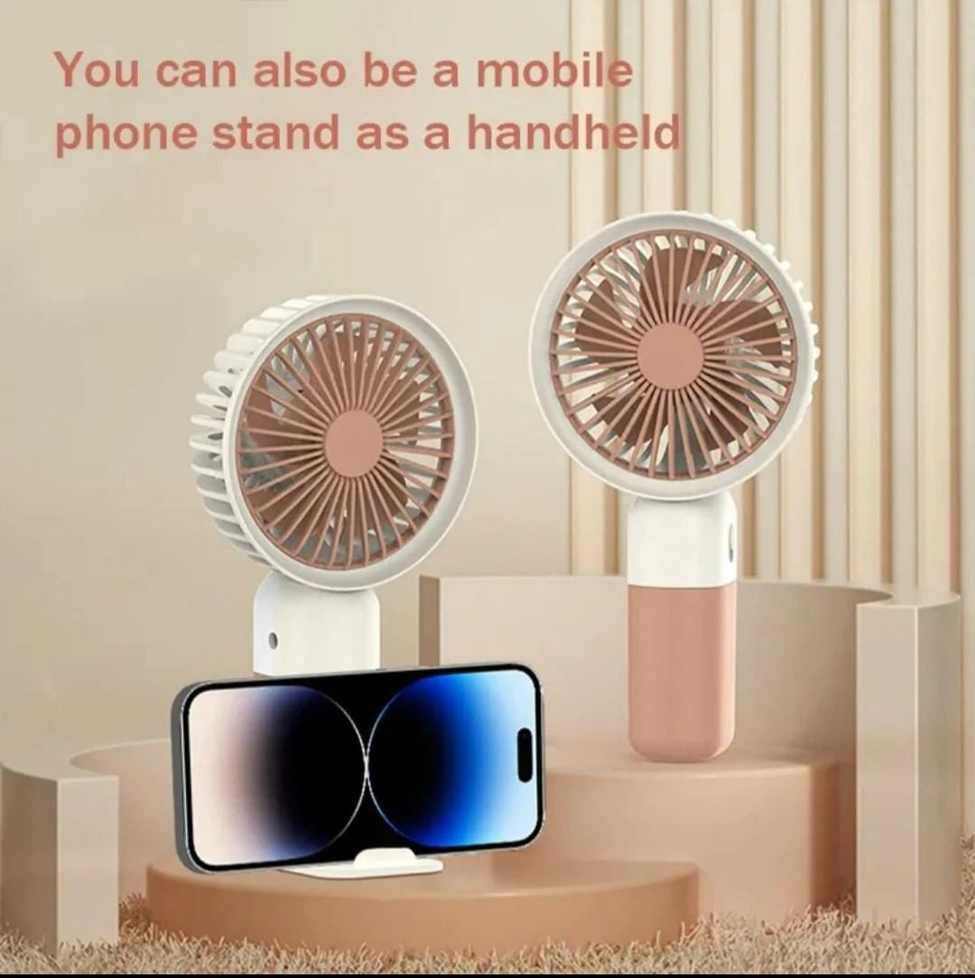imgi_9_WhatsApp_Image_2025-06-21_at_5.53.36_AM_1200x.jpg Mini Cute Fan – Portable USB Rechargeable Handheld Cooling Fan for Kids & Adults, Stand/Base Included (Random Color) - Image 4